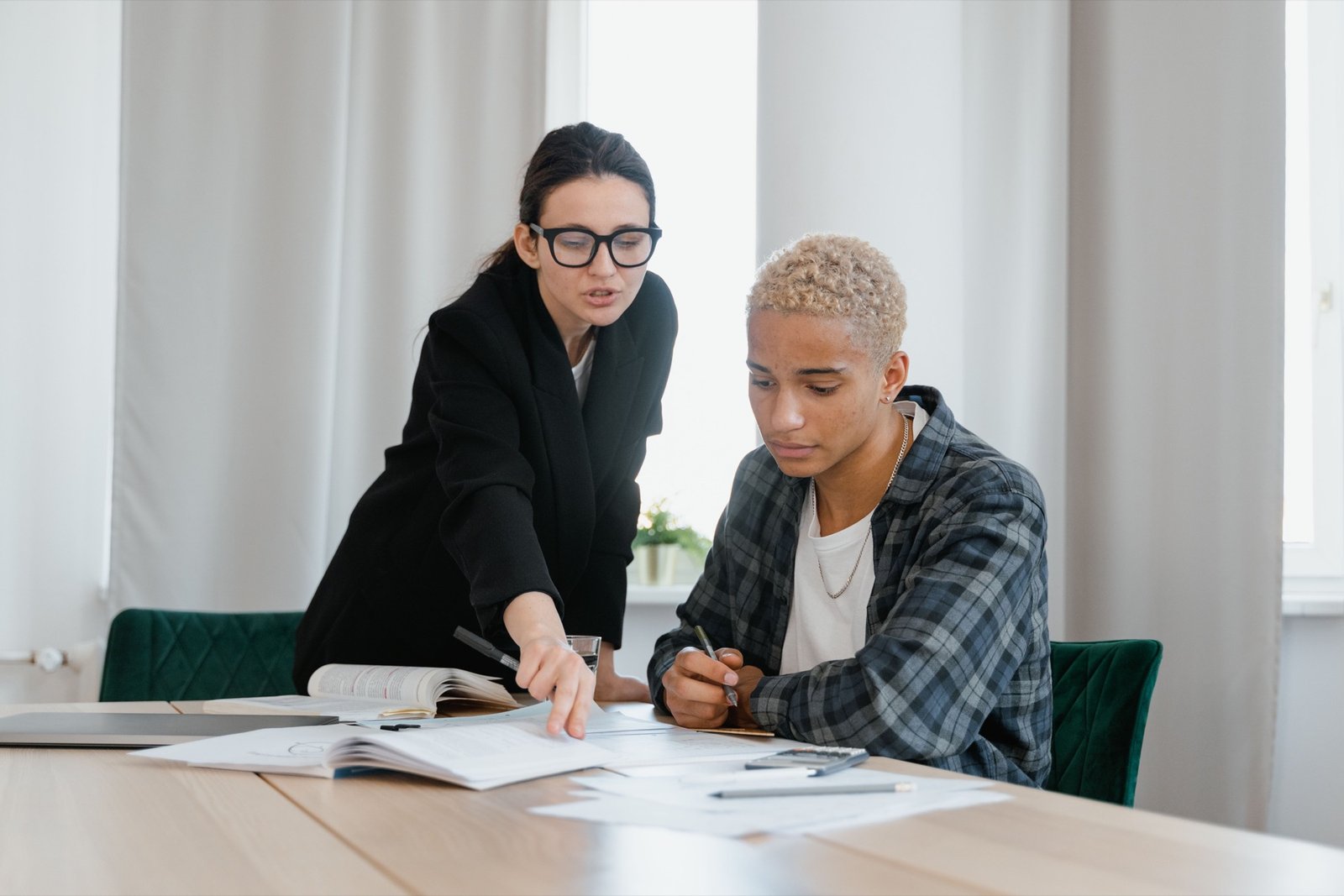 Sixth-form student working with an A-Level tutor